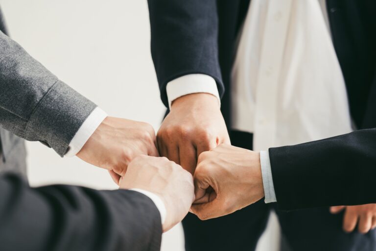 Teamwork, team building, responsibility and equal opportunities. Hand holding together